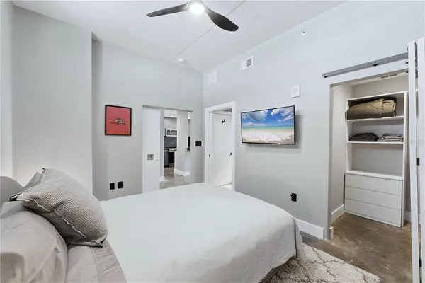 a bedroom with a bed and a view of bedroom