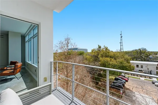 a view of a balcony with chairs
