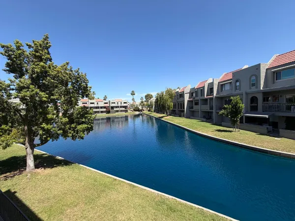 a view of swimming pool with outdoor seating