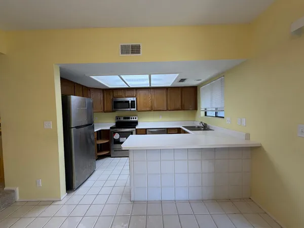 a kitchen that has a sink and a stove