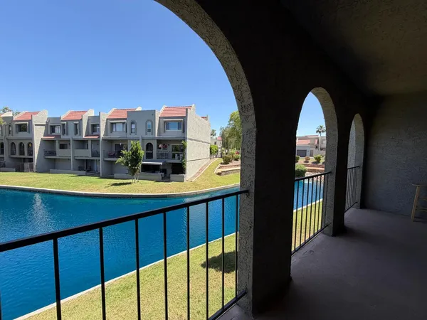 a view of swimming pool from a balcony