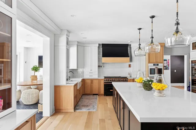 a kitchen with a sink appliances and cabinets