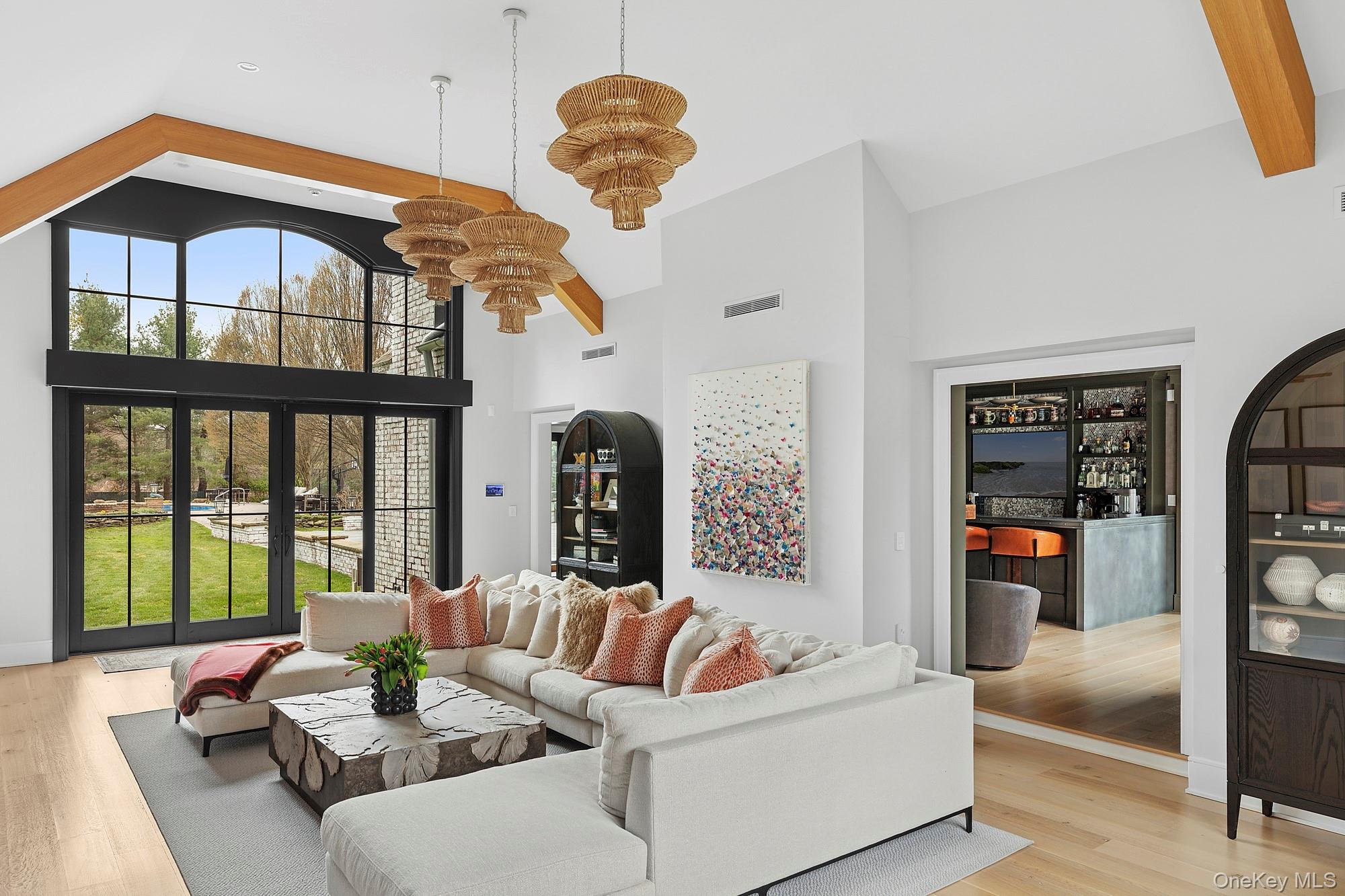 89 Pound Hollow Road Glen Head, NY 11545 - Photo 2 of 26 a living room with furniture fireplace and a large window