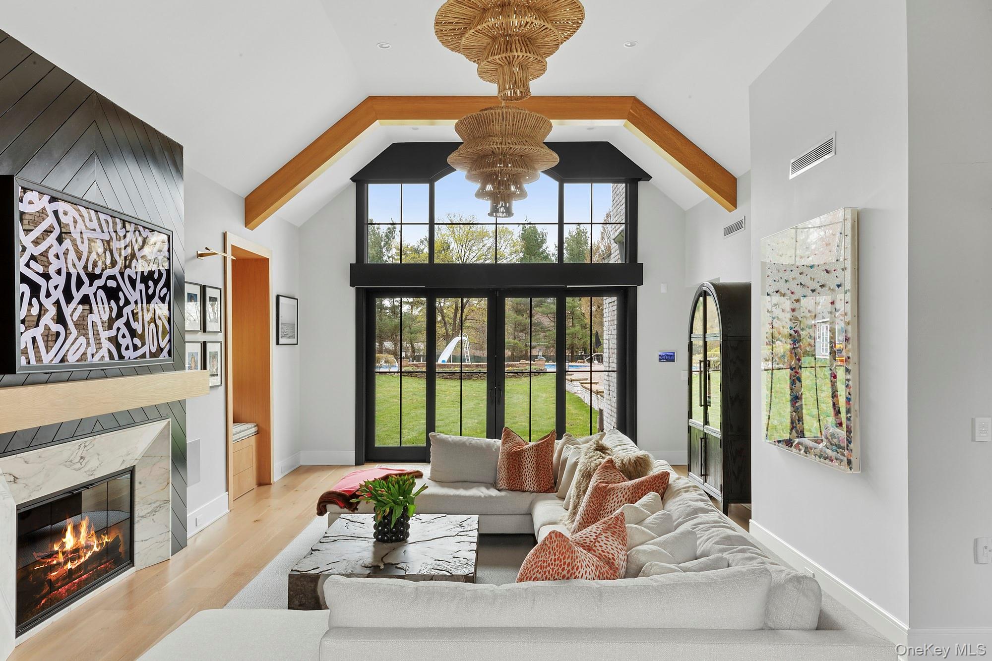 89 Pound Hollow Road Glen Head, NY 11545 - Photo 3 of 26 a living room with furniture and a fireplace