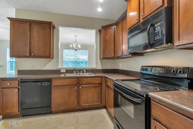 a kitchen with a stove and a sink