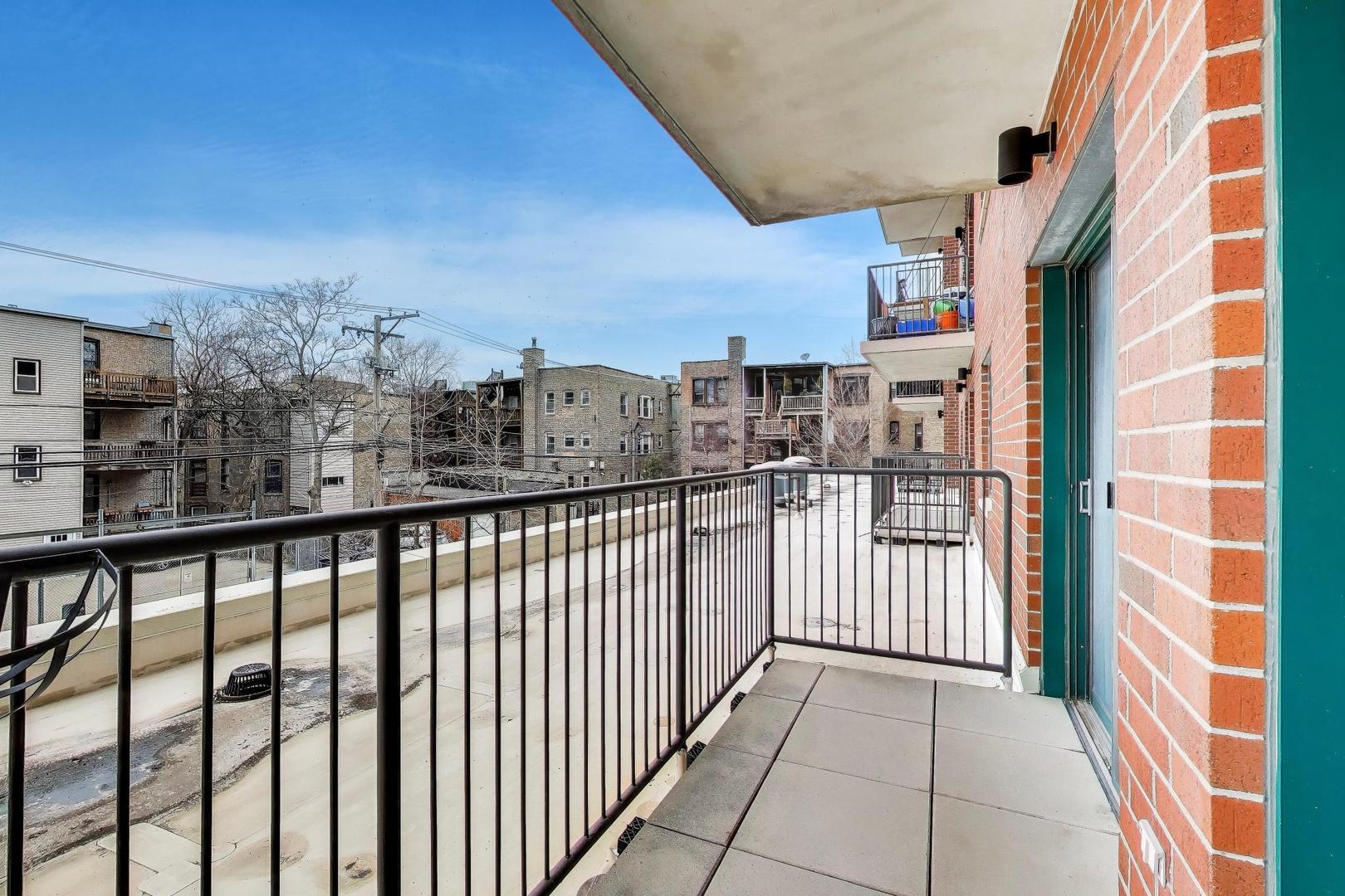 4848 North Sheridan Road, Unit 203 Chicago, IL 60640 - Photo 14 of 32 a view of a balcony with wooden floor