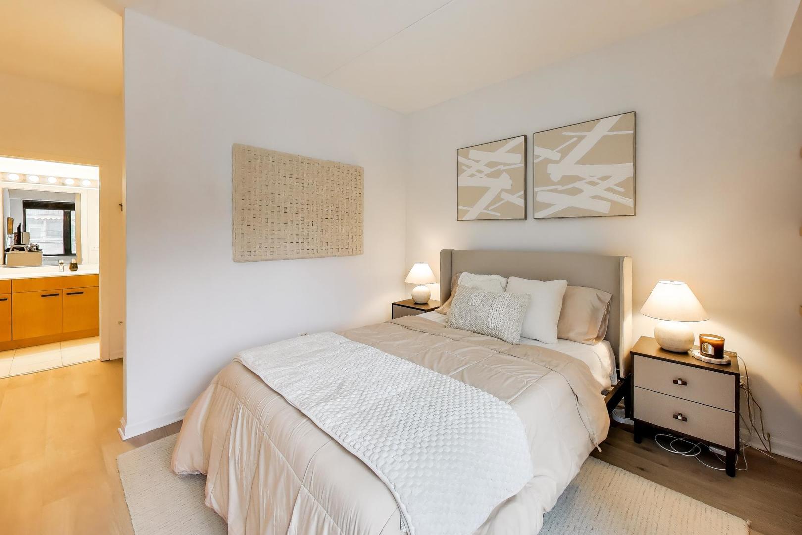 4848 North Sheridan Road, Unit 203 Chicago, IL 60640 - Photo 17 of 32 a bedroom with a bed and a lamp