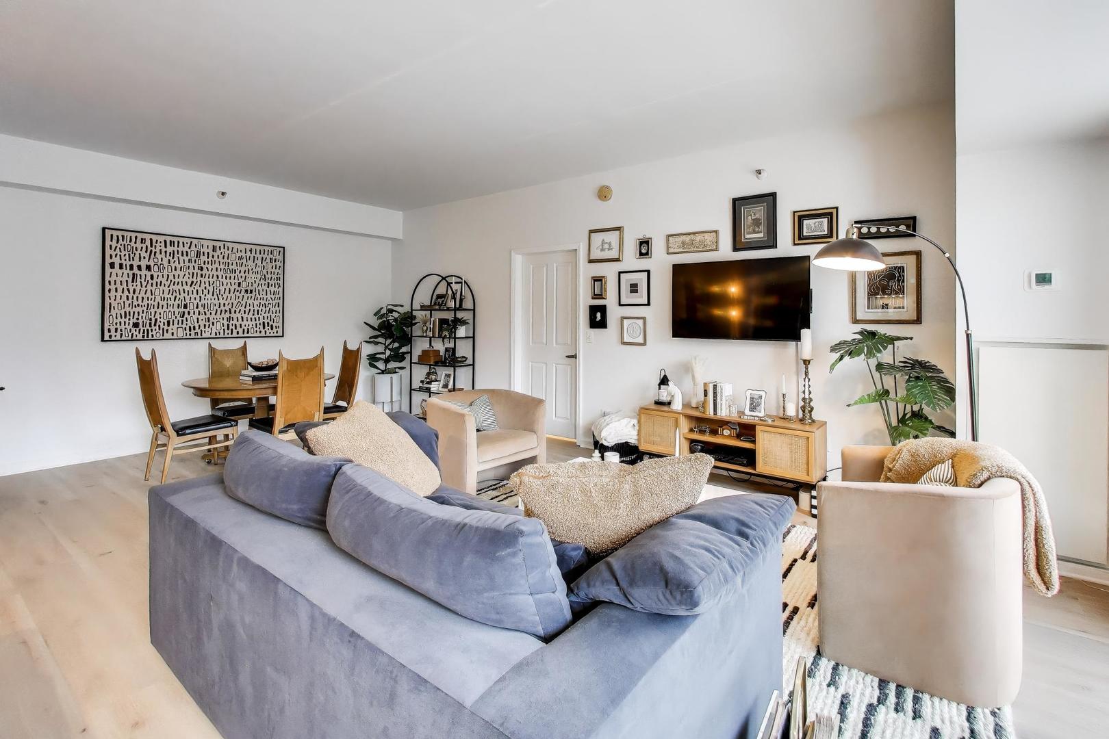 4848 North Sheridan Road, Unit 203 Chicago, IL 60640 - Photo 6 of 32 a living room with furniture and a flat screen tv