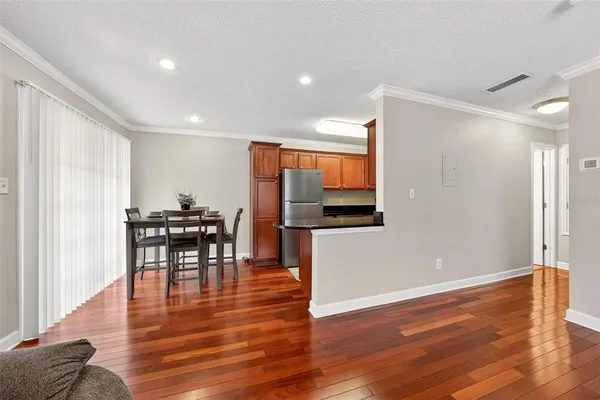 a view of kitchen with cabinets and wooden floor