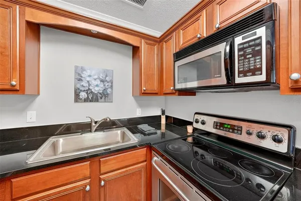a kitchen with a stove and a sink