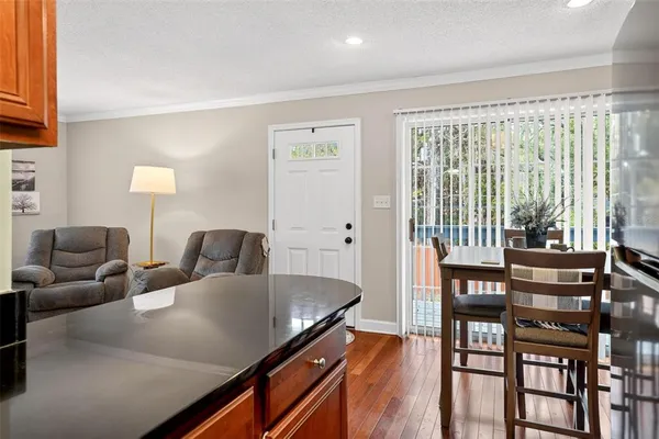 a living room with furniture and large windows