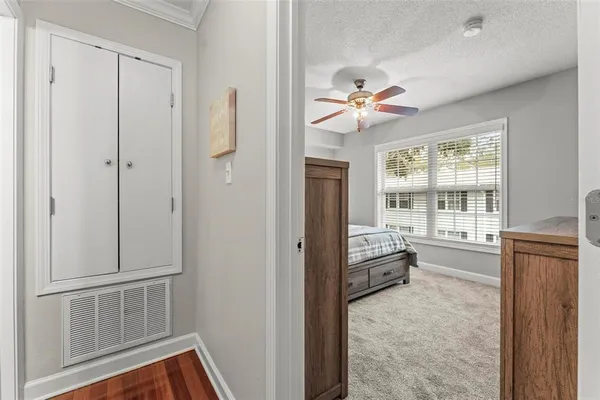 a view of an entryway with chandelier fan