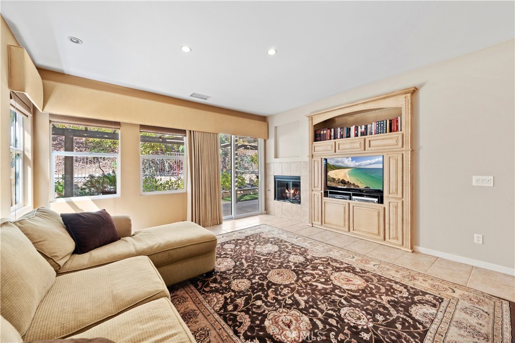 24575 Lowe Drive Corona, CA 92883 - Photo 12 of 44 a living room with furniture and a flat screen tv