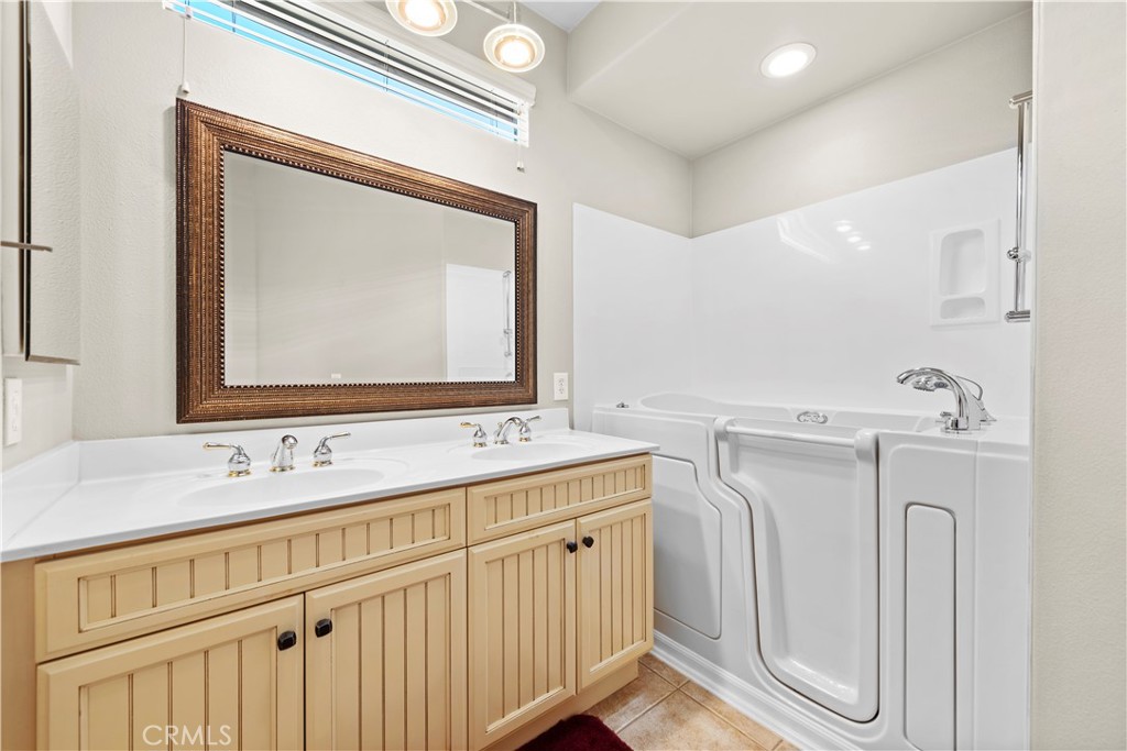 24575 Lowe Drive Corona, CA 92883 - Photo 17 of 44 a bathroom with double vanity sink and two mirror