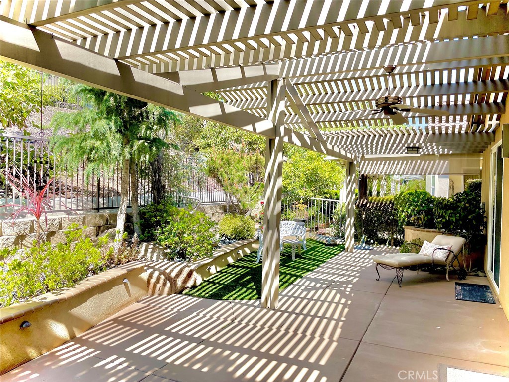 24575 Lowe Drive Corona, CA 92883 - Photo 24 of 44 a view of a patio with table and chairs and potted plants