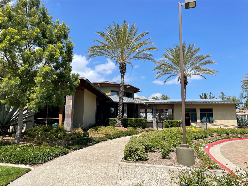 24575 Lowe Drive Corona, CA 92883 - Photo 31 of 44 a front view of a house with a yard and garage