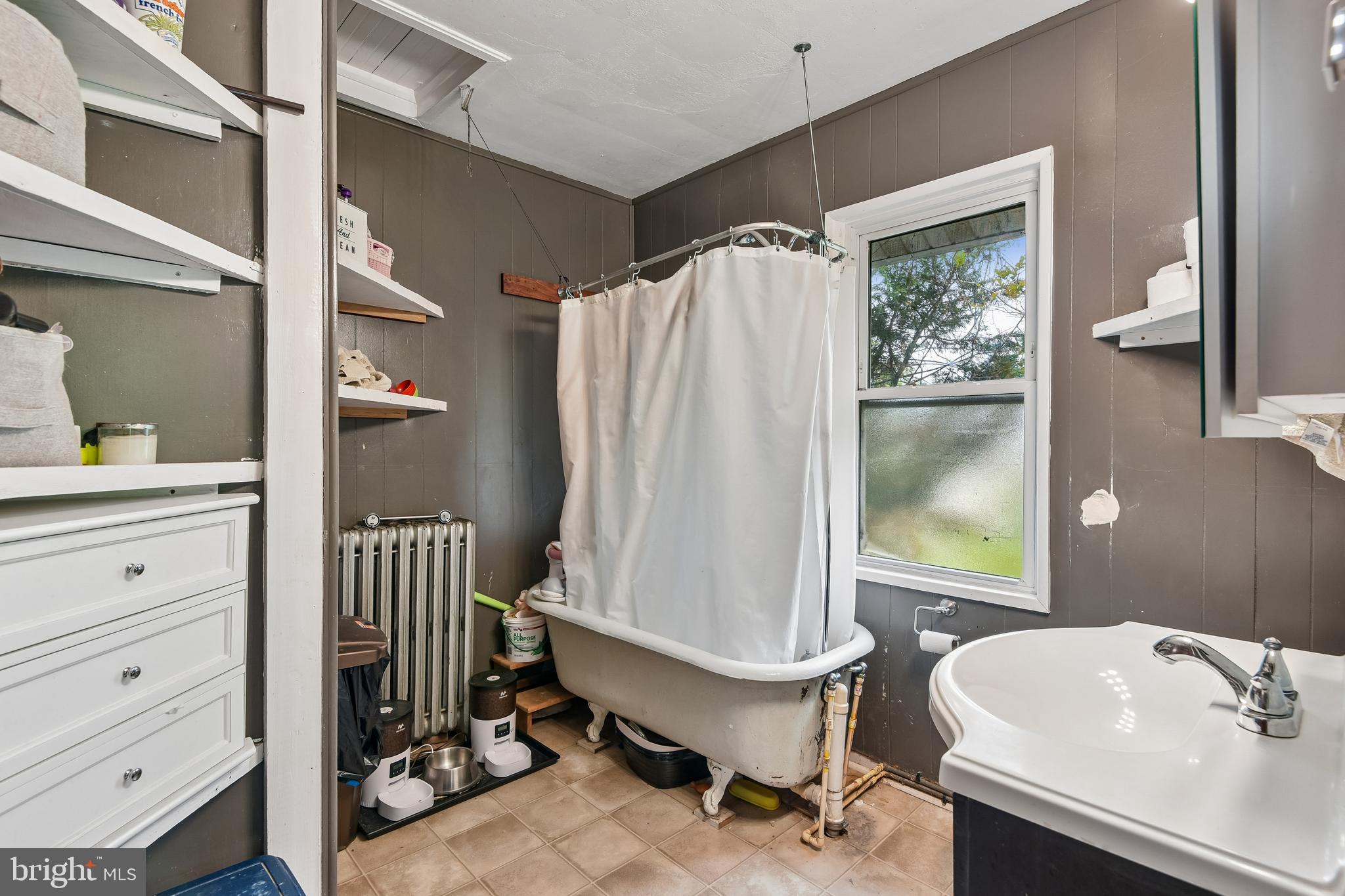 301 Custis Street Aberdeen, MD 21001 - Photo 16 of 29 a bathroom with a sink toilet and a mirror