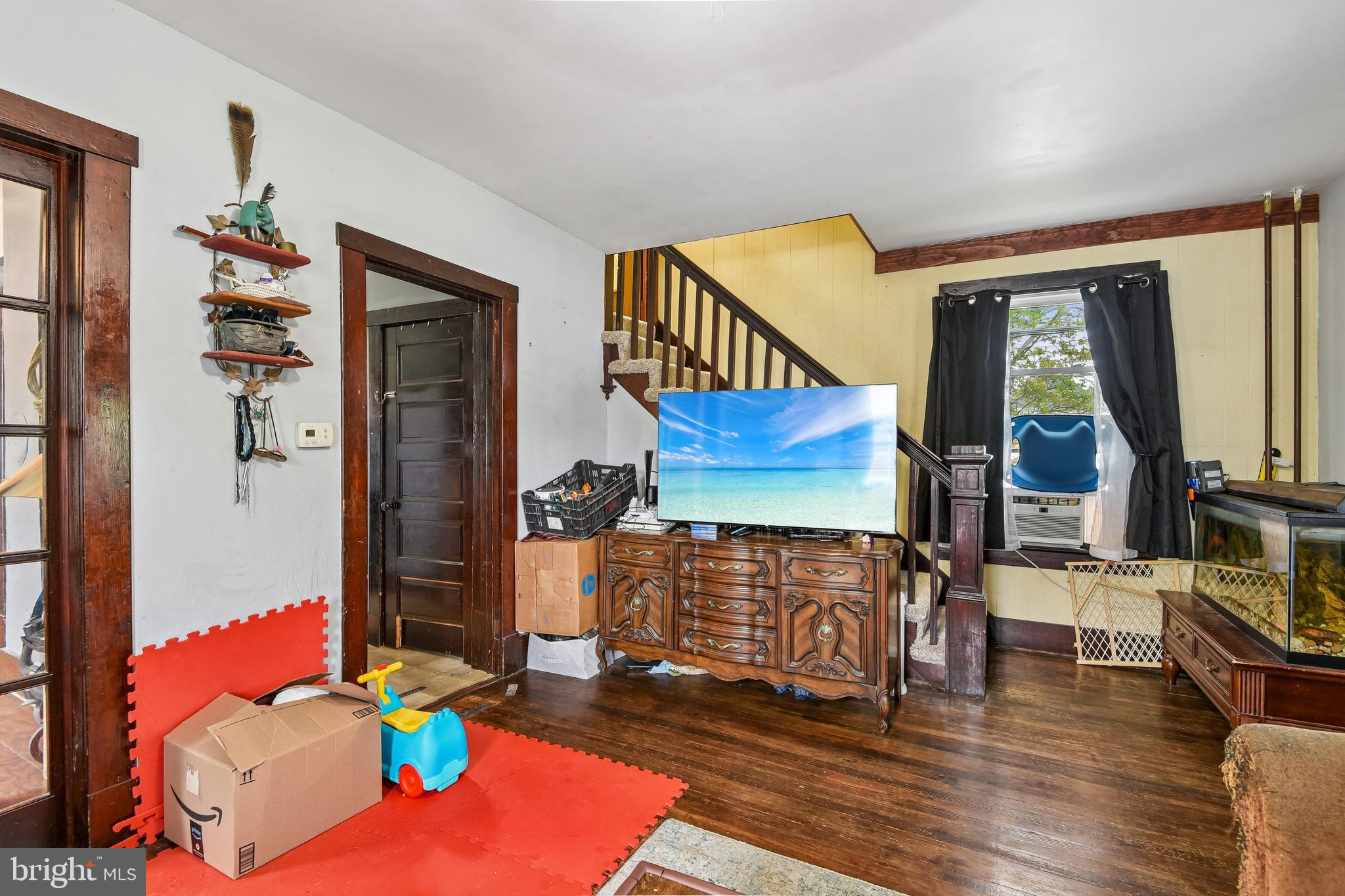 301 Custis Street Aberdeen, MD 21001 - Photo 3 of 29 a living room with furniture a fireplace and wooden floor