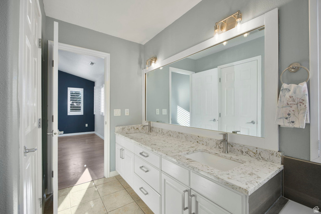 1440 West 100 South Virgin, UT 84779 - Photo 21 of 45 Dual vanity with white cabinetry and integrated sinks set beneath a large framed mirror