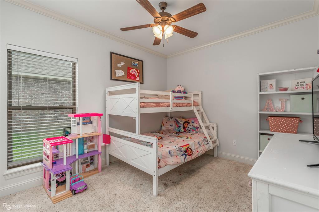 711 Reeds Reef Bossier City, LA 71112 - Photo 27 of 36 a bedroom with furniture and a bed
