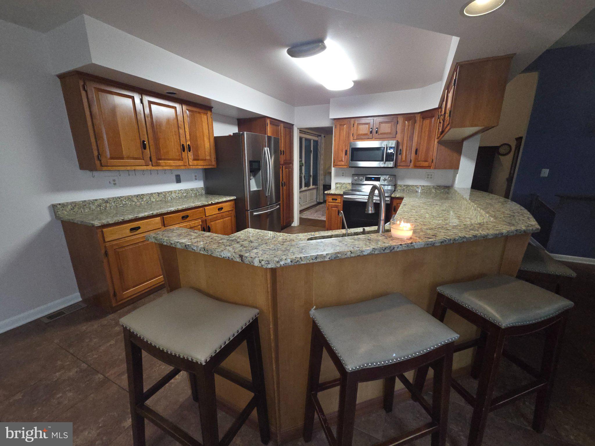 151 Martz Road Sykesville, MD 21784 - Photo 11 of 74 Modern kitchen with warm wood accents.