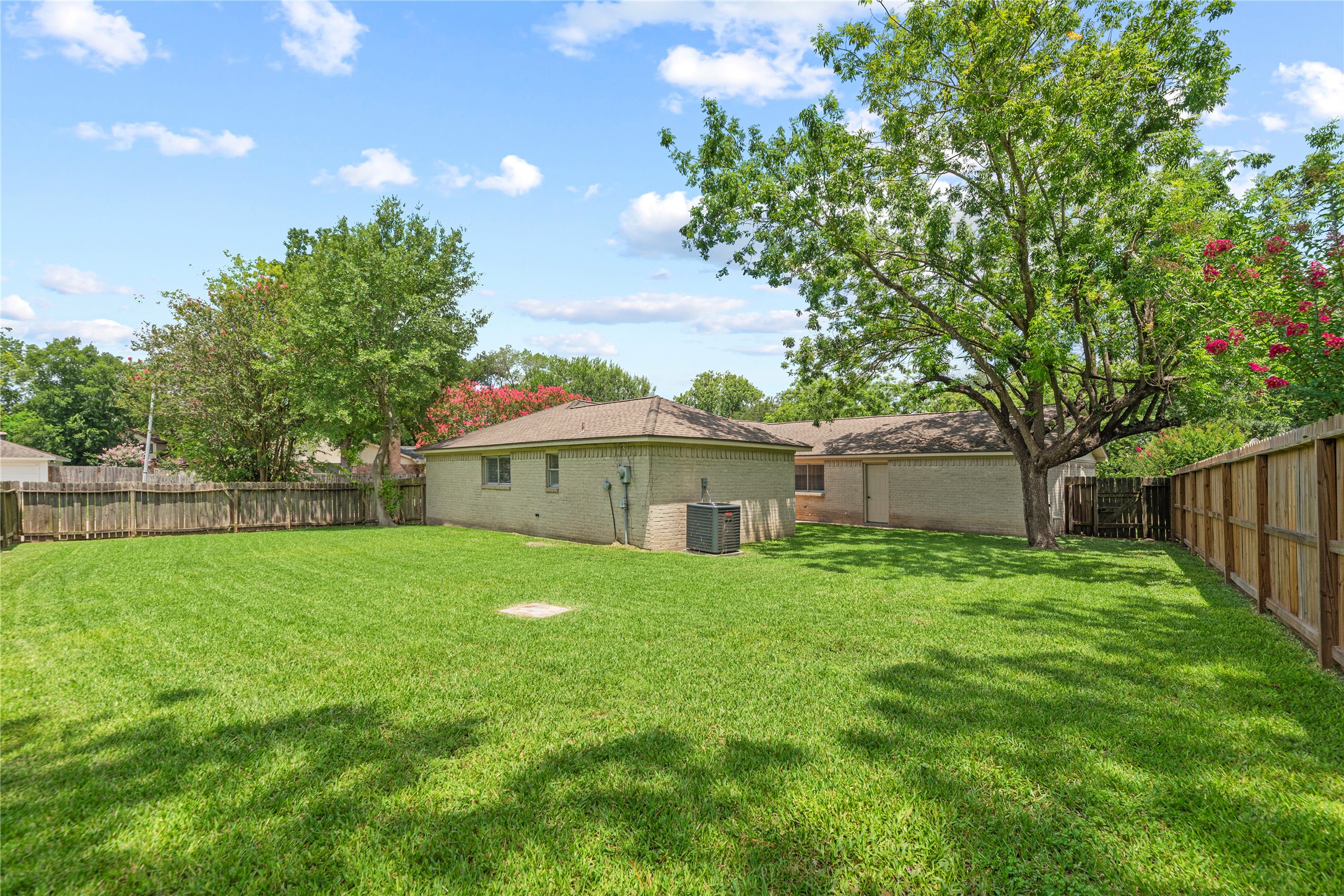 6931 Sandy Knolls Drive Spring, TX 77379 - Photo 20 of 21 Expansive fenced backyard with plenty of room for entertaining, play, or a future garden.
**6931 Sandy Knolls Dr., Spring, TX 77379**