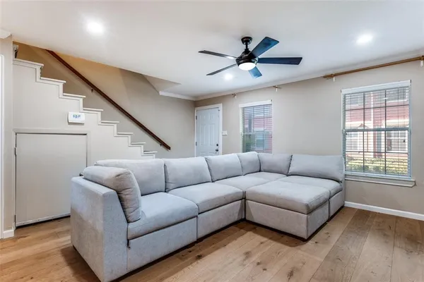 a living room with furniture and a window