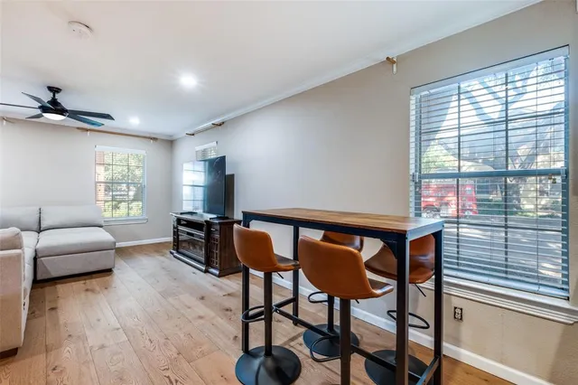 a view of a livingroom with furniture and a window