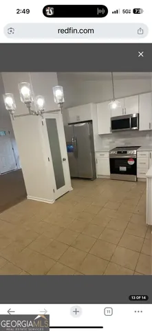 a view of kitchen and microwave