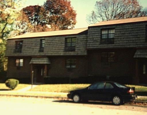 48 Enid Street, Unit C Bridgeport, CT 06606 - Photo 1 of 1 a black car parked in front of a house