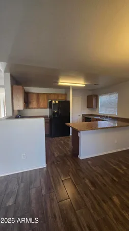 a kitchen with stainless steel appliances a stove and a refrigerator