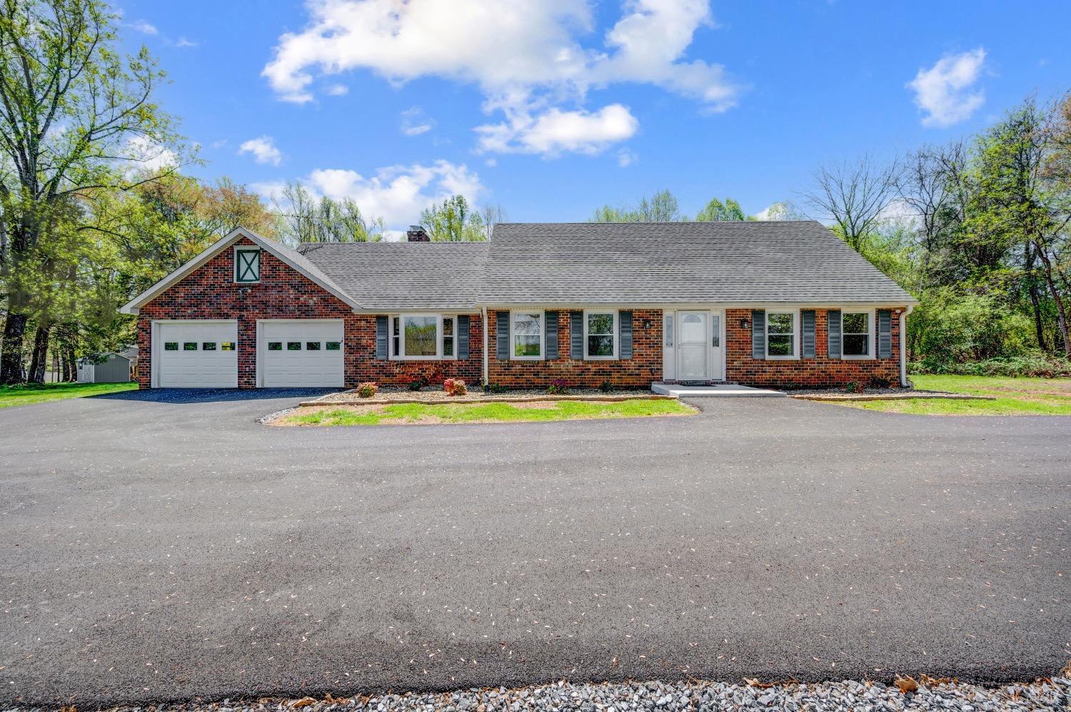 a front view of a house with swimming pool and porch