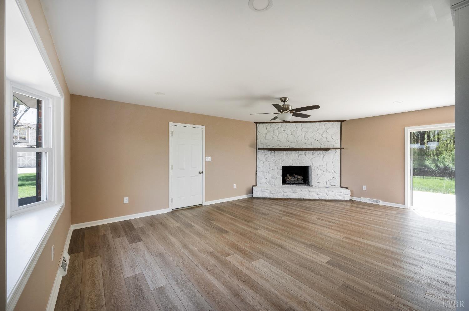 4070 Cottontown Road Forest, VA 24551 - Photo 14 of 38 a view of an empty room with wooden floor and a window