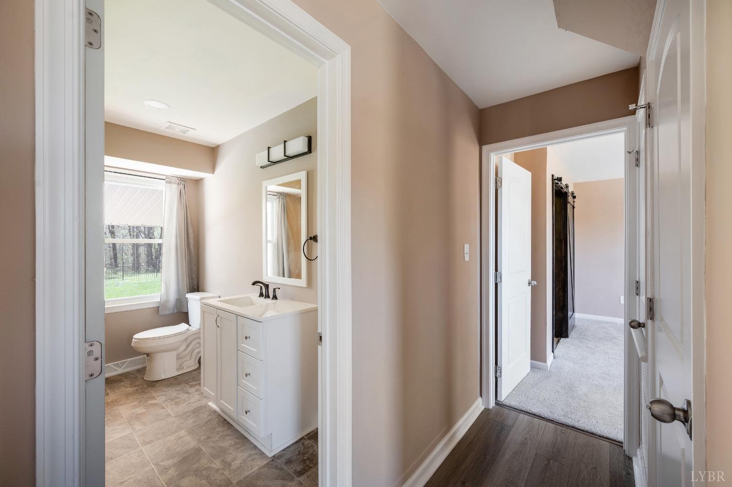 4070 Cottontown Road Forest, VA 24551 - Photo 16 of 38 a bathroom with a sink toilet and shower