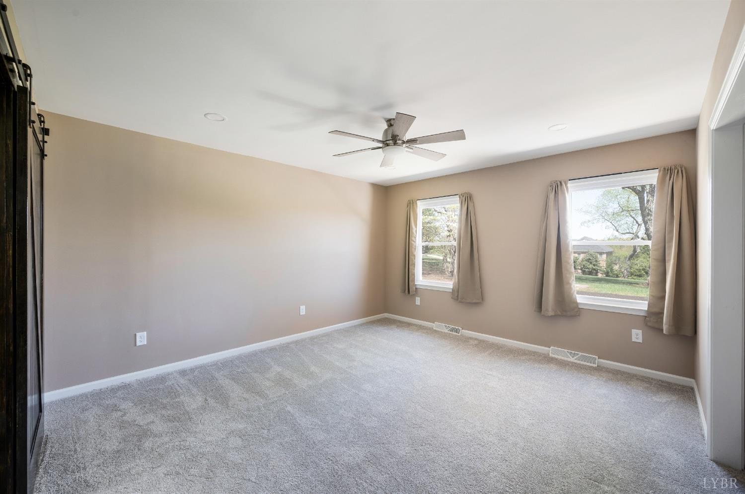 4070 Cottontown Road Forest, VA 24551 - Photo 18 of 38 an empty room with windows and closet
