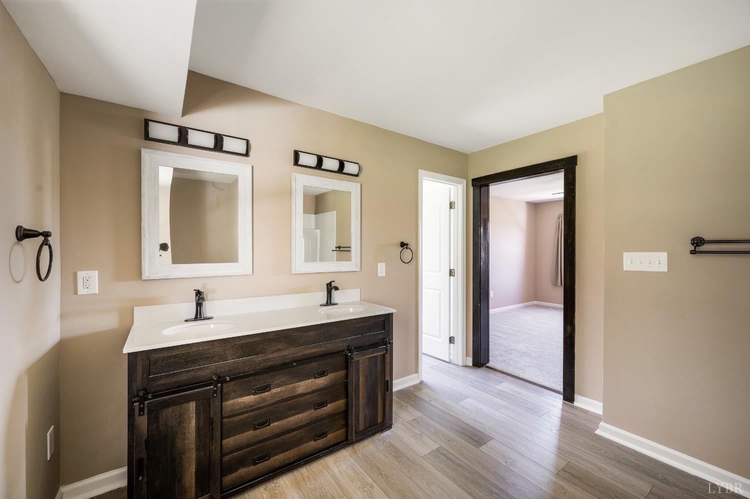 4070 Cottontown Road Forest, VA 24551 - Photo 21 of 38 a en suite bathroom with a sink and a mirror