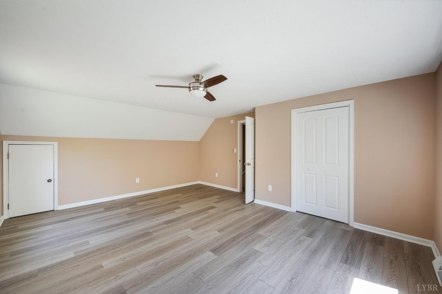 4070 Cottontown Road Forest, VA 24551 - Photo 28 of 38 an empty room with wooden floor and windows