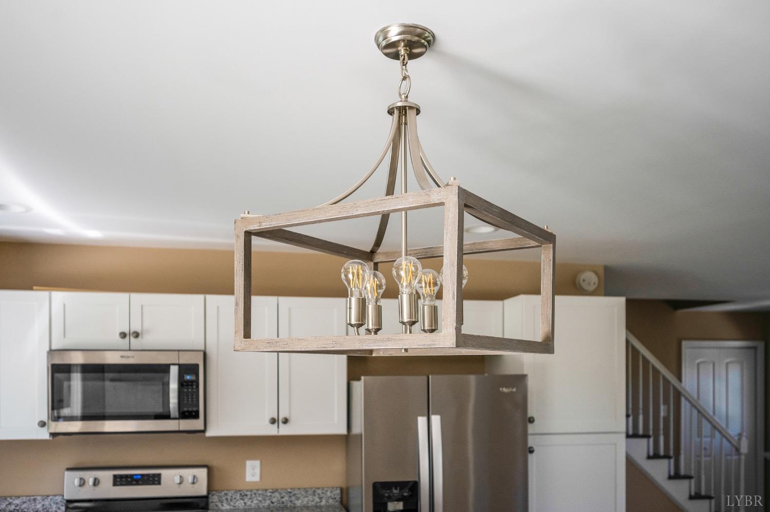4070 Cottontown Road Forest, VA 24551 - Photo 9 of 38 a kitchen with stainless steel appliances a microwave a refrigerator and cabinets