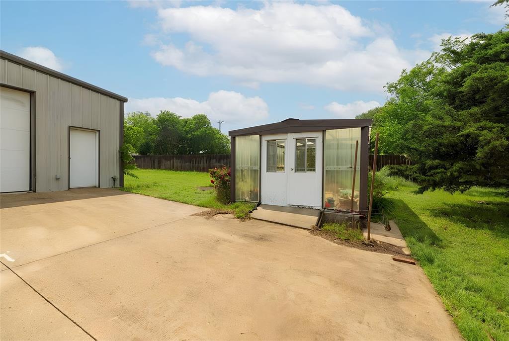405 Kimbrough Road Azle, TX 76020 - Photo 36 of 39 a view of a house with backyard and garden