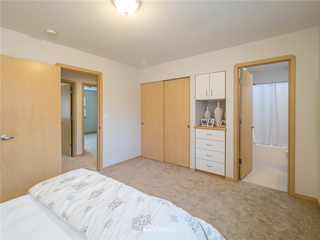 1307 196th Place Southeast Bothell, WA 98012 - Photo 11 of 25 a view of a bedroom with closet and cabinet