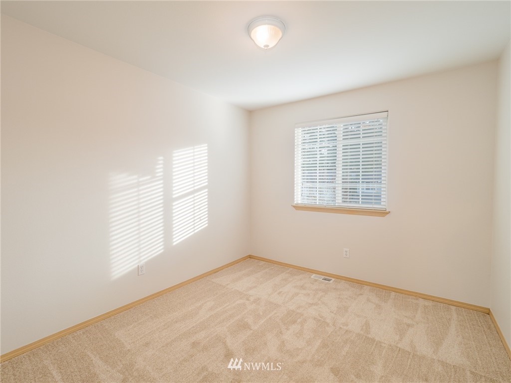 1307 196th Place Southeast Bothell, WA 98012 - Photo 13 of 25 an empty room with windows
