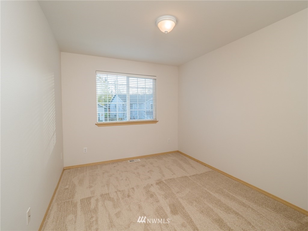 1307 196th Place Southeast Bothell, WA 98012 - Photo 14 of 25 an empty room with a window