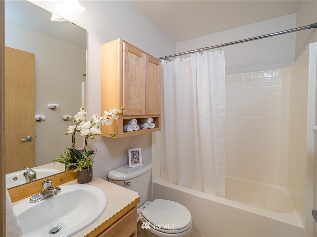1307 196th Place Southeast Bothell, WA 98012 - Photo 15 of 25 a bathroom with a sink toilet and shower