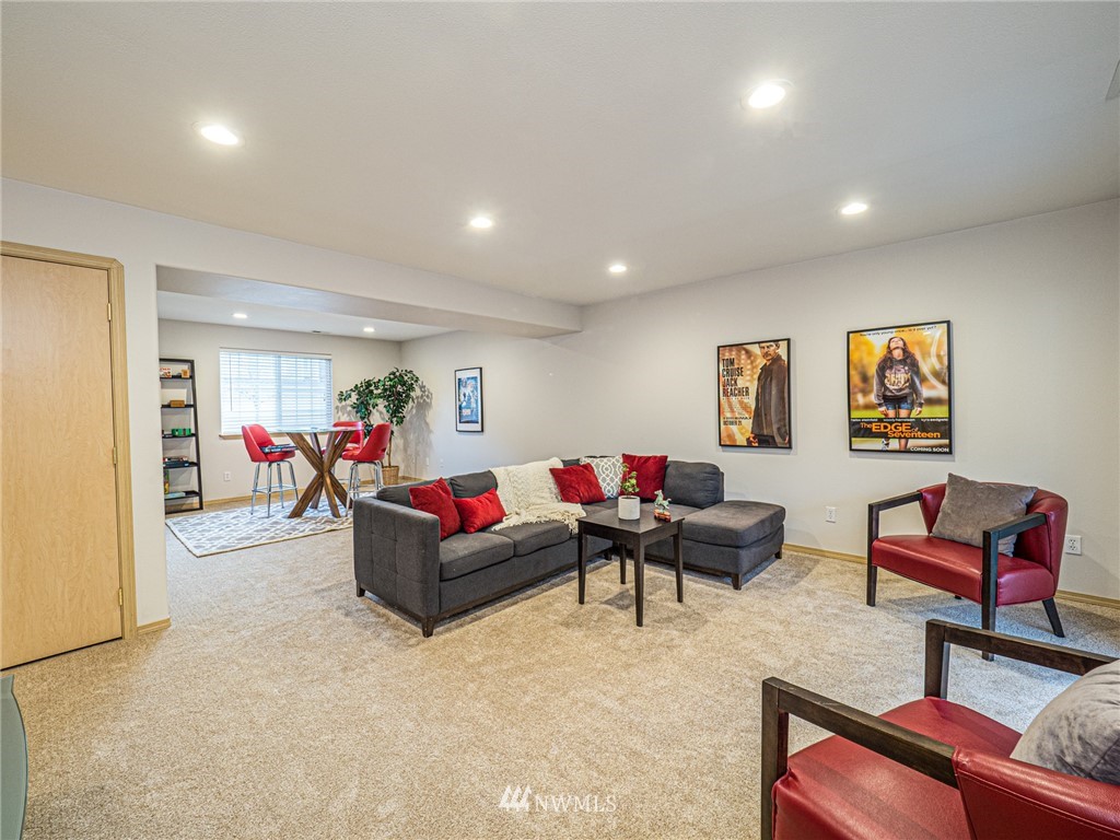 1307 196th Place Southeast Bothell, WA 98012 - Photo 17 of 25 a living room with furniture and a couch