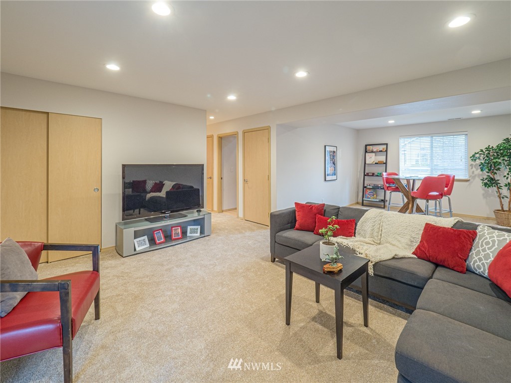 1307 196th Place Southeast Bothell, WA 98012 - Photo 18 of 25 a living room with furniture and a flat screen tv