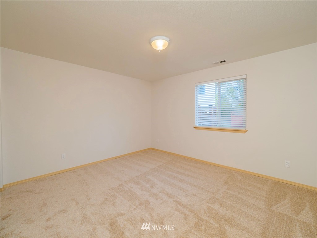 1307 196th Place Southeast Bothell, WA 98012 - Photo 19 of 25 an empty room with a window