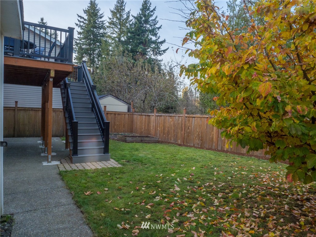 1307 196th Place Southeast Bothell, WA 98012 - Photo 23 of 25 a view of yard with green space and wooden fence