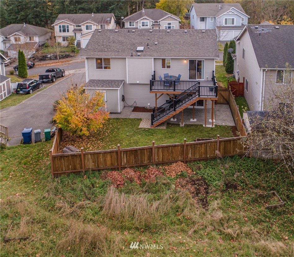 1307 196th Place Southeast Bothell, WA 98012 - Photo 25 of 25 an aerial view of a house with a yard