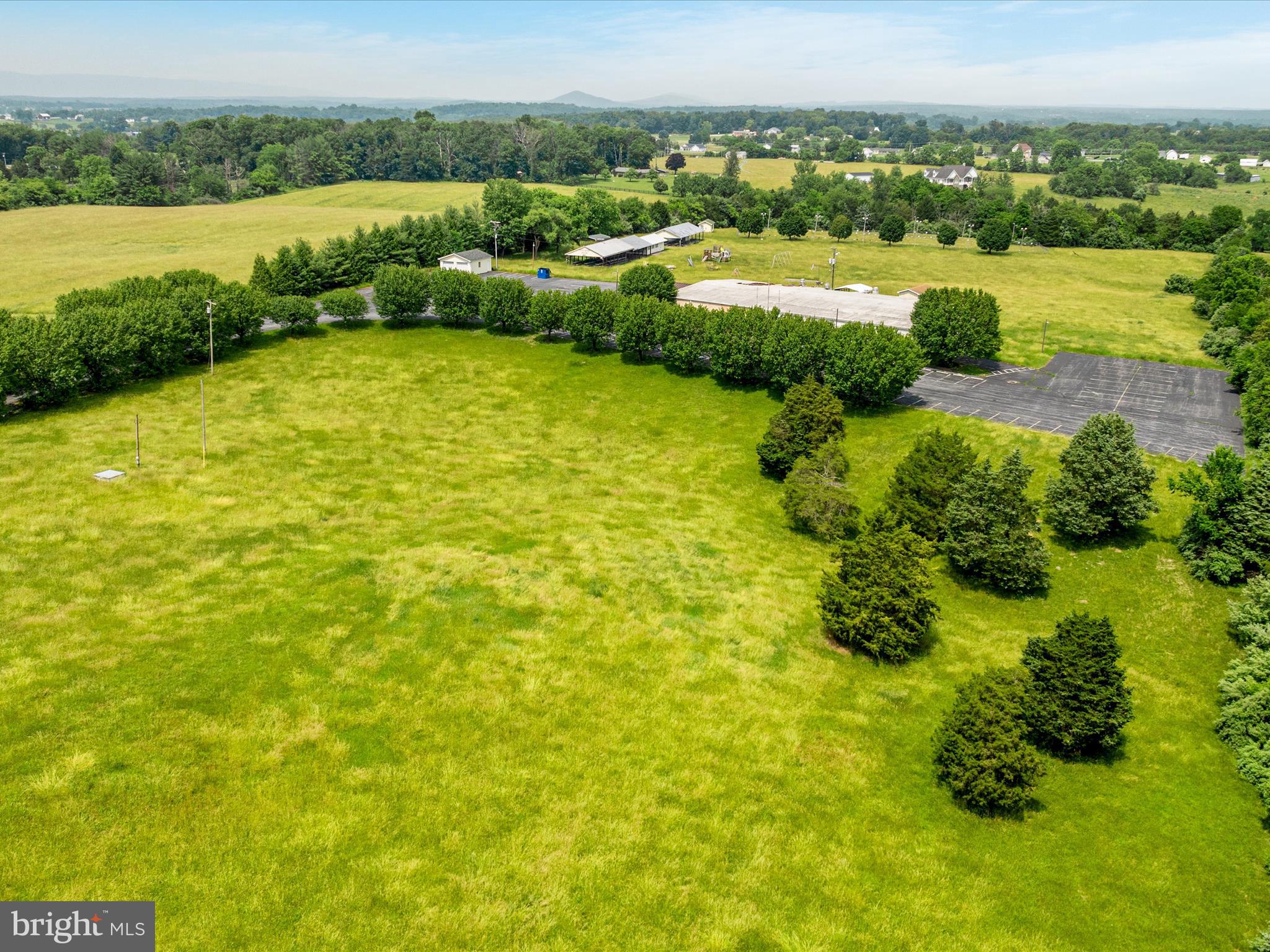 572 Red Bud Road Strasburg, VA 22657 - Photo 15 of 18 a view of a lake with houses in the back
