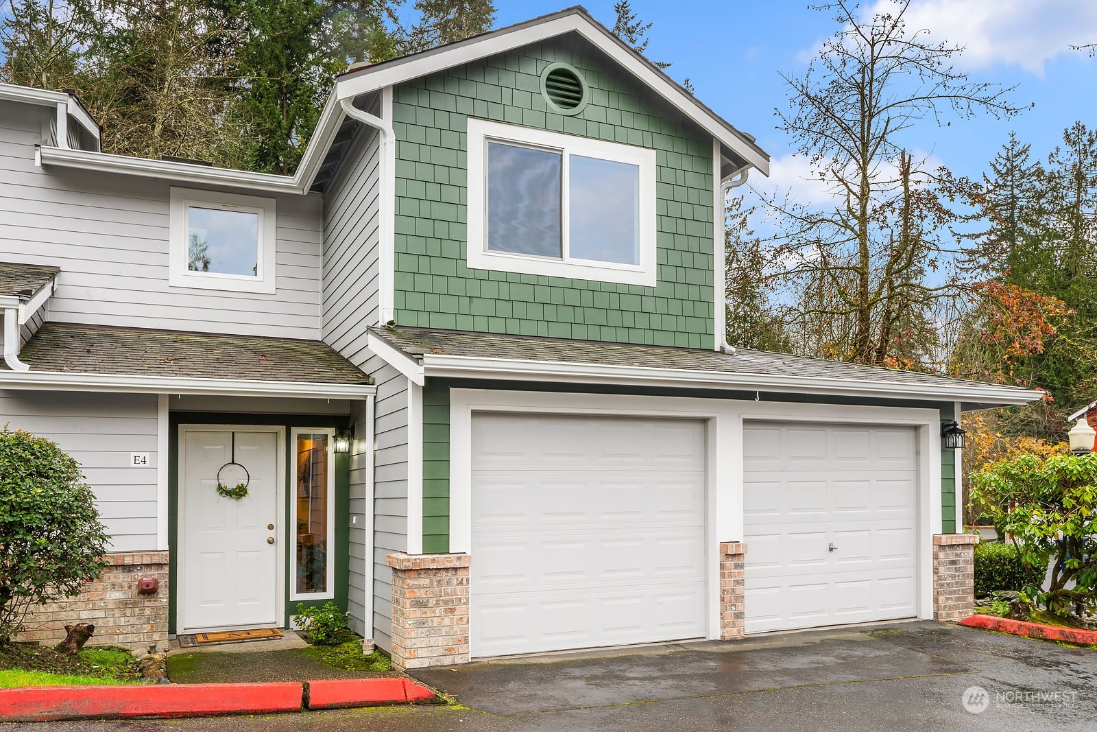 a front view of a house with garage